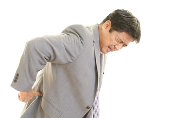 腰痛を訴えるビジネスマン