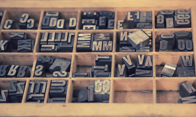typographical letters in wooden box