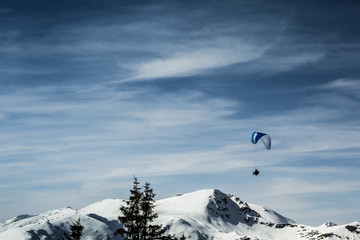 Naklejka na ściany i meble Beautiful mountain view with paraglider
