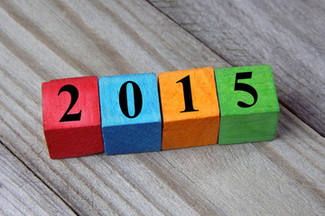 concept of Happy New year 2015 on wooden colorful cubes