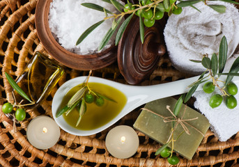 Spa and wellness setting with olive fruits, oil and salt. Top v