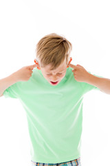 model isolated on plain background plugging ears with fingers
