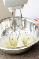 electric mixer with a dough with beaten