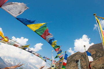 Colorful flags. Annapurna Circuit - turists trek in Himalayas