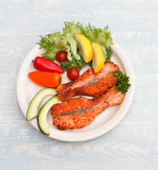 Grilled red fish medallions with vegetables