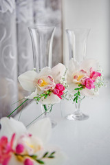 Wedding glasses decorated with orchids