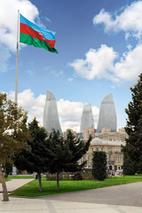 View of the Flame Towers skyscraper with azerbaijan flag in Baku