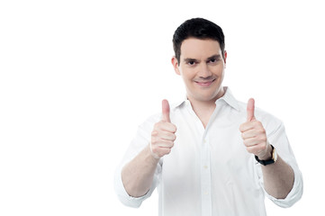 Successful man showing thumbs up gesture