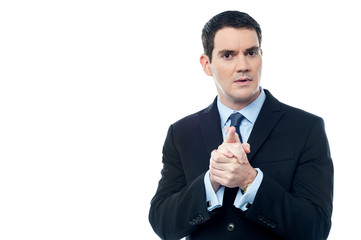 Calm businessman with clasped hands