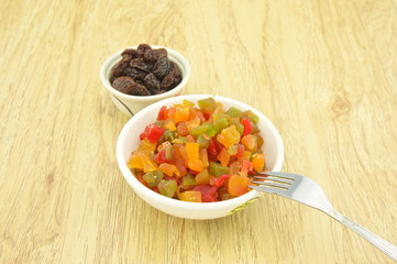 Close up dried fruit and raisin with fork