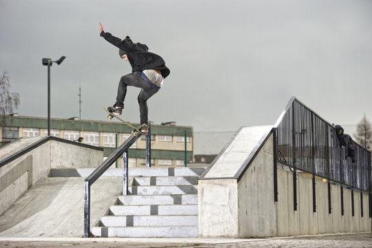 skateboarder trick in skatepark