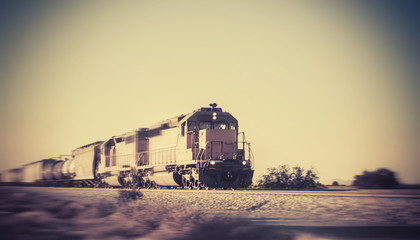 Fototapeta premium Freight train traveling through desert Arizona
