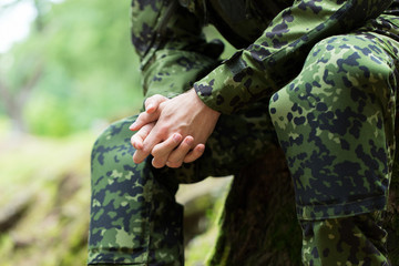 close up of young soldier in military uniform