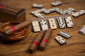 Cigars in ash tray on table