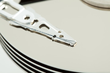 Inside of open and corrupted HDD hard drive disk, narrow focus