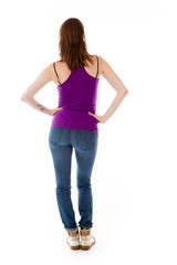 model isolated on plain background back hands on hips