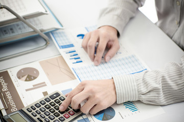 Fototapeta na wymiar Businessman analyzing investment charts. Accounting