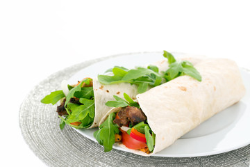 Two warps served with meat and vegetables.