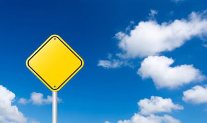 blank yellow traffic sign with blue sky background