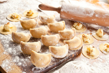 Fototapeta na wymiar Vareniki (dumplings) with potatoes and onion.
