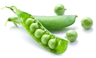 Fresh peas are contained within a pod.