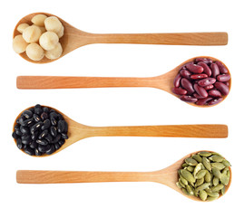 Red beans, black beans, pumpkin seeds and macadamia isolated on