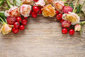 Roses on wooden background