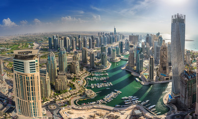 DUBAI, UAE - OKTOBER 10: Modern buildings in Dubai Marina, Dubai - obrazy, fototapety, plakaty