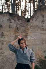 brunette on sea coast in autumn