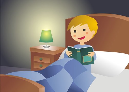 Niño leyendo en la cama