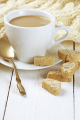 Coffee with cookies and knitwear