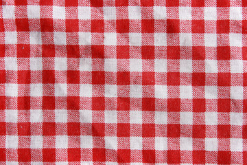 Texture of a red and white checkered picnic blanket.
