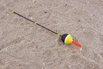 Fishing floats in the sand