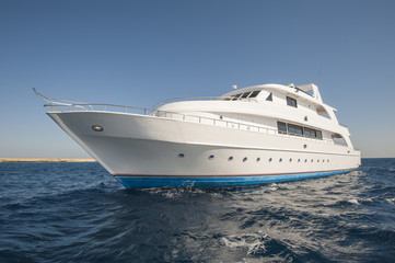 Obraz na płótnie Canvas Luxury motor yacht at sea