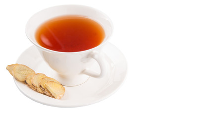 Ginger slices and a cup of tea over white background