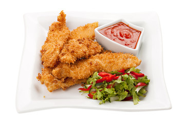 Fried chicken breast fillet in batter with vegetable salad on th