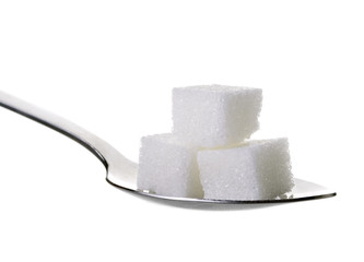 cube sugars in teaspoon isolated on white background