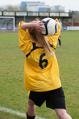 Female Football Player Throw In