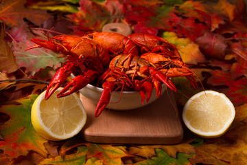 Red boiled crawfish on wooden plank