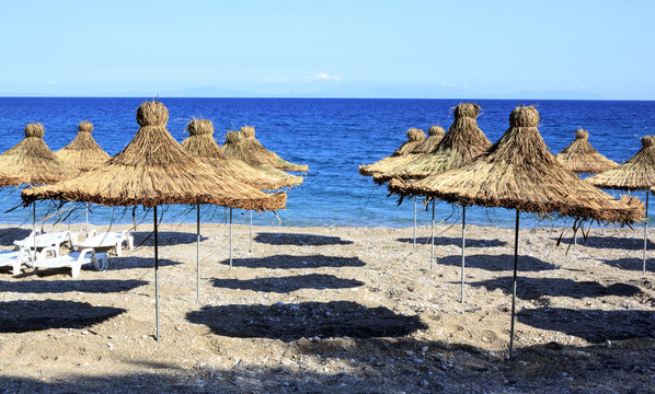 wickerwork sun umbrellas on the beach