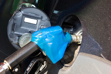 Obraz na płótnie Canvas put in diesel gasoline fuel in car at gas station.