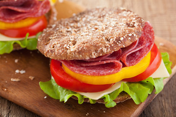 healthy sandwich with salami tomato pepper and lettuce