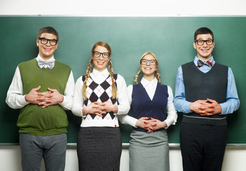 Group of nerds  in front of the blackboard