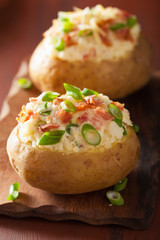 baked potato in jacket with bacon and cheese
