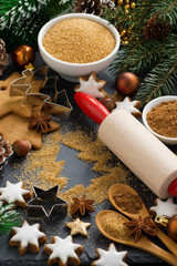 Christmas baking - ingredients and cookies, vertical