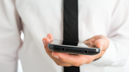 Businessman Showing Mobile Phone on Hand