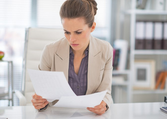 Business woman working with documents in office