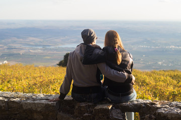Hugging couple enjoying sunset