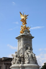 Fototapeta na wymiar Victoria Monument on Buckingham Palace roundabout in London, UK