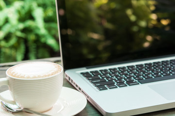 Fototapeta premium Coffee cup and laptop business